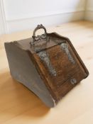 A Victorian oak coal receiver.