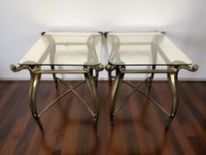 A pair of contemporary bronzed metal and glass topped occasional tables,
