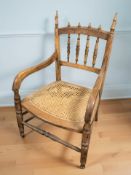 An early 20th century beech occasional chair.