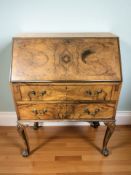 A 20th century walnut fall front bureau, 75 cm x 42 cm x 101 cm.