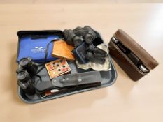 A pair of Tasco 8x30mm binoculars, Praktica binoculars, a gent's travel set,
