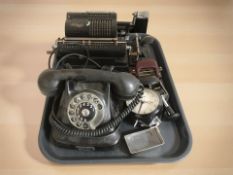 A vintage Walther mechanical calculator, Bakelite telephone, metal hole punches,