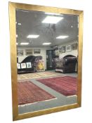 A contemporary large bevelled mirror, 194 cm x 138 cm.