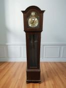 A reproduction Tempus Fugit Grandmother clock,