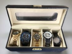 A watch display box containing five watches including Michael Kors, Invicta, replica Rolex, etc.