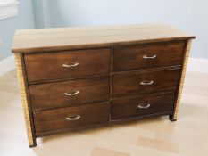 A contemporary six drawer bedroom chest, 140 cm x 53 cm x 86 cm.