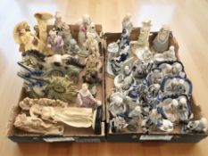 Assorted continental blue and white figures and groups, decorative mantel clocks, other figurines.