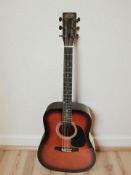 A Stagg acoustic guitar.