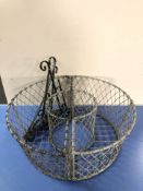 A pair of wire metal basket planters, width 60 cm, and three wall brackets.