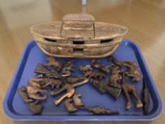 A carved wooden Noah's Ark model and a quantity of similar animal figures.