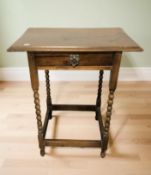 An Edwardian oak single drawer side table, width 61 cm.