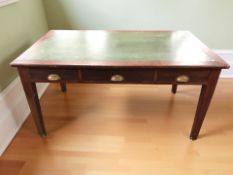 A late Victorian stained oak three drawer library table with leather inset panel,