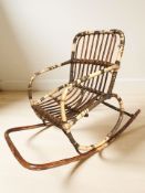 A child's wicker rocking chair, length 72 cm.