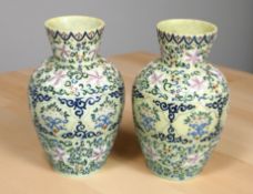A pair of Victorian hand painted opaque glass vases, height 24 cm.