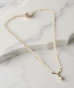 A single-strand cultured pearl necklace with 9ct gold clasp and central pendant, length 42cm.