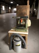 A DeWalt Powershop circular saw, with a wooden worktable, dust extractor, etc.