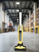 A Karcher floor cleaner.