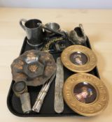 A pair of continental porcelain plaques, a desk punch, cutlery, other metal wares.