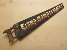 A novelty vintage handsaw with later painting.