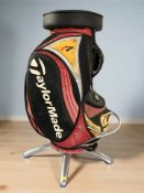 A contemporary bar stool in the form of a golf bag, on chrome base, height 90 cm.