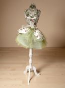 A mannequin on stand,