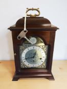 A reproduction mahogany Tempus Fugit bracket clock, with key, height 39 cm.