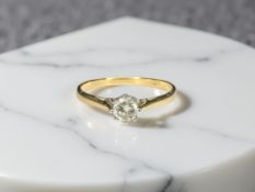 A gold diamond solitaire ring, approximately 0.20 carat, size O½ CONDITION REPORT: 1.