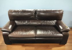 A contemporary brown stitched leather three seater and matching two seater settee,