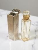 A small silver-cased scent bottle, height 5.5cm.