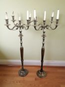 A pair of turned wood and chrome candelabra,