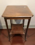An Edwardian inlaid mahogany occasional table.