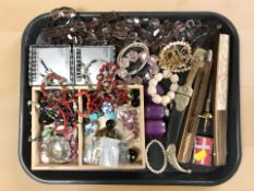 A group of costume jewellery, letter knife, oriental fan,