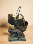 A Victorian patinated metal figure of a lion on green faux marble plinth,