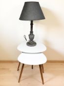 A contemporary table lamp and a nest of two tables.