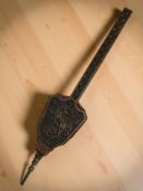 A late Victorian carved oak bellows, length 104 cm.