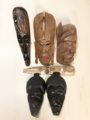 A group of African carved hardwood masks (1 box)