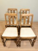 A set of four 1920's oak dining chairs.