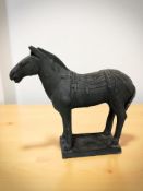 A 20th century pottery figure of a horse, height 32 cm., purchased from the British museum shop.