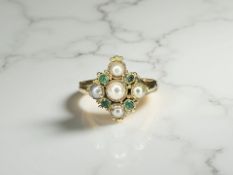 An antique emerald and pearl ring,