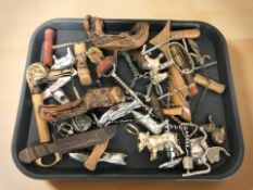 A collection of novelty corkscrews and bottle openers.