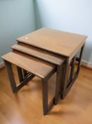 A reproduction nest of tables,
