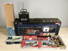 A remote control helicopter in box, a Sopwith F1 Camel flying scale modelling kit, remote control,