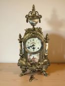 A reproduction continental brass mantel clock, with Franz Hermle movement striking on a bell,
