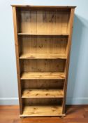 A modern pine open bookcase,