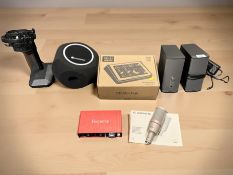 A Focusrite 2i2 2nd gen audio interface in associated box,