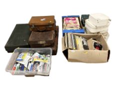 A collection of vintage suitcases, jewellery cases, LP records and singles,