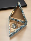 A crocodile skin effect triangular shaped storage box retailed by Smythson of Bond Street,