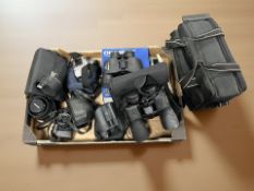 A pair of Nikon 12 x 50 Action EX binoculars, Olymous 8 x 40 binoculars, Dynax camera,
