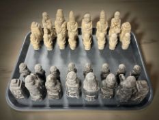 A resin Persian style chess set,