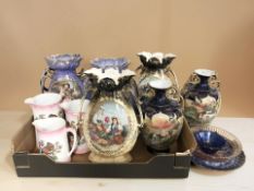 A group of transfer printed pottery vases, graduated jugs,
